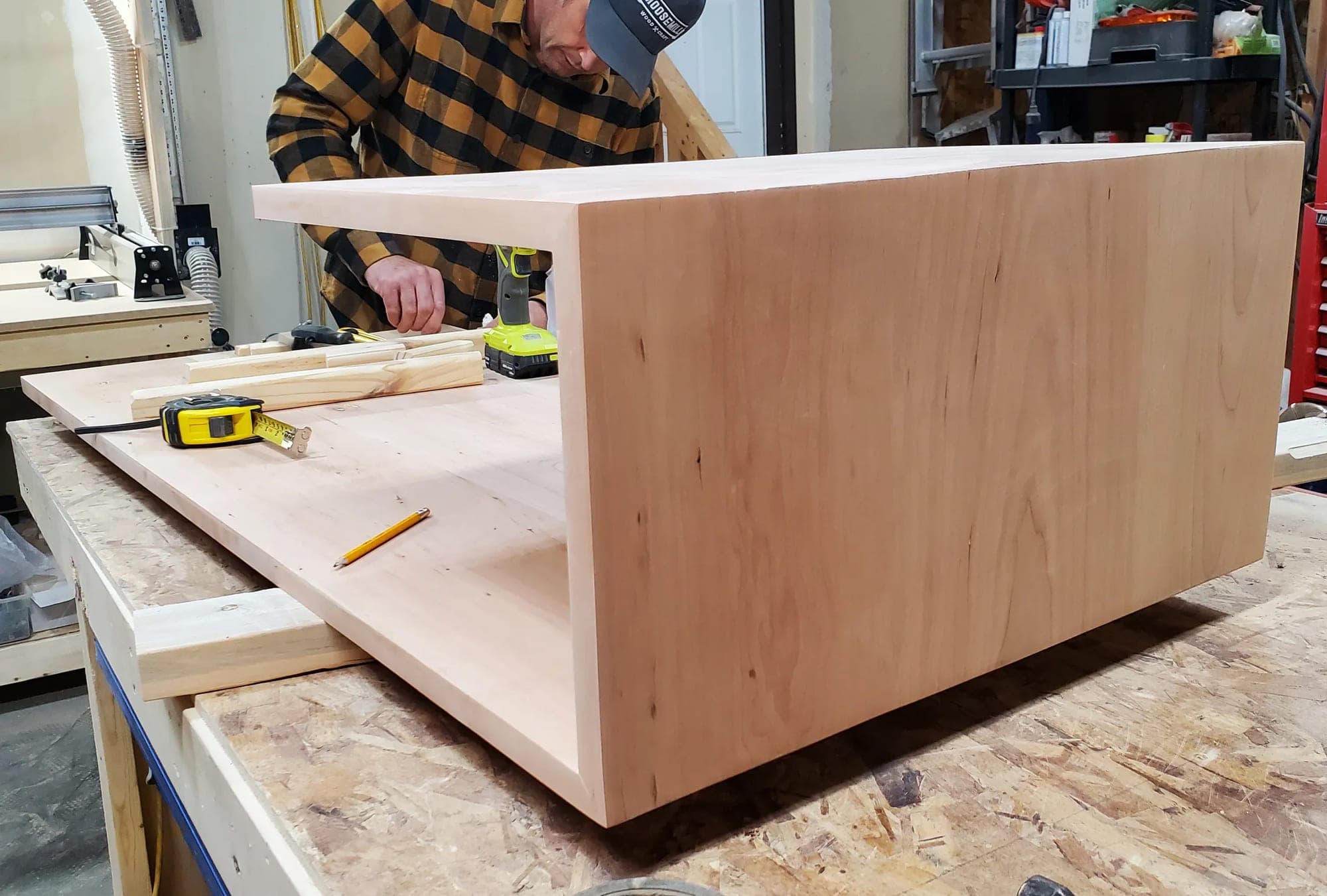 Lee building a solid wood coffee table in the shop