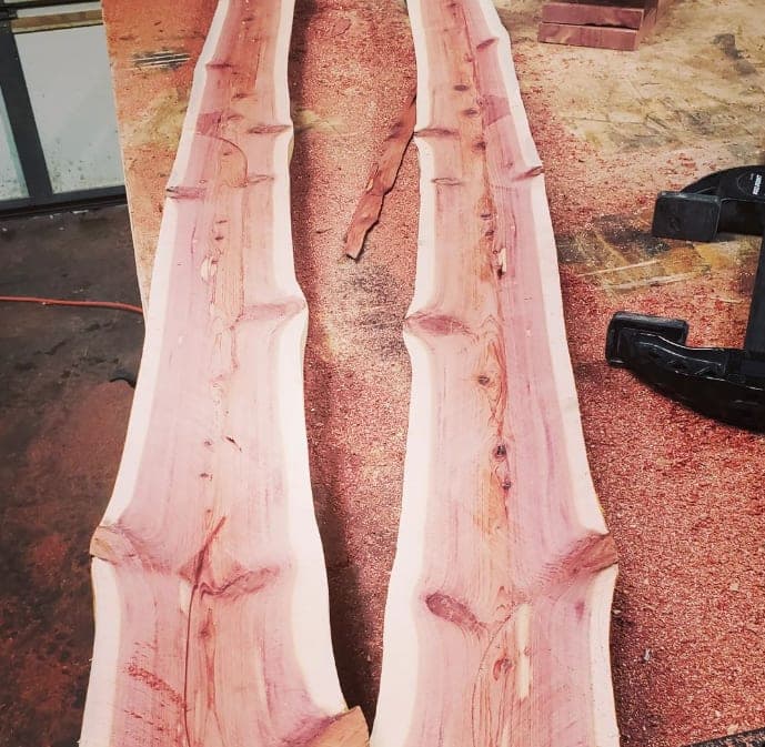 Cedar posts split in half, showing the grain
