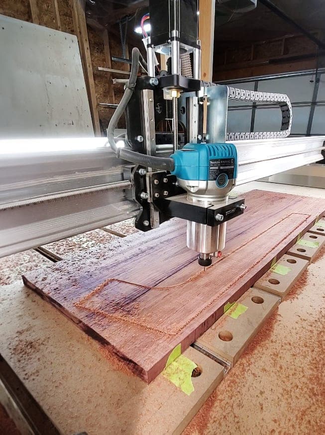 The Moose Mill CNC router cutting a hardwood board