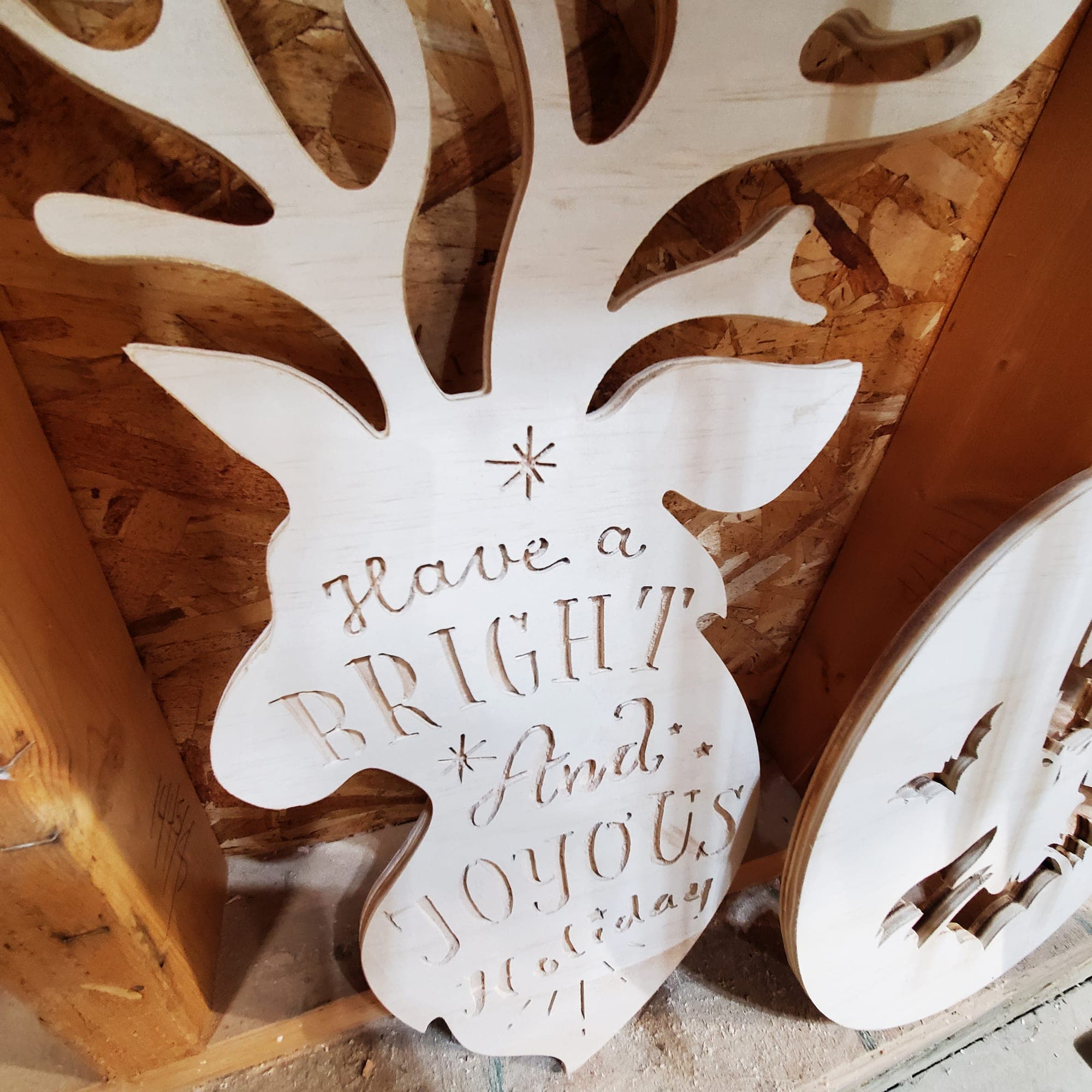 CNC-cut reindeer holiday sign reading Have a Bright and Joyous Holiday
