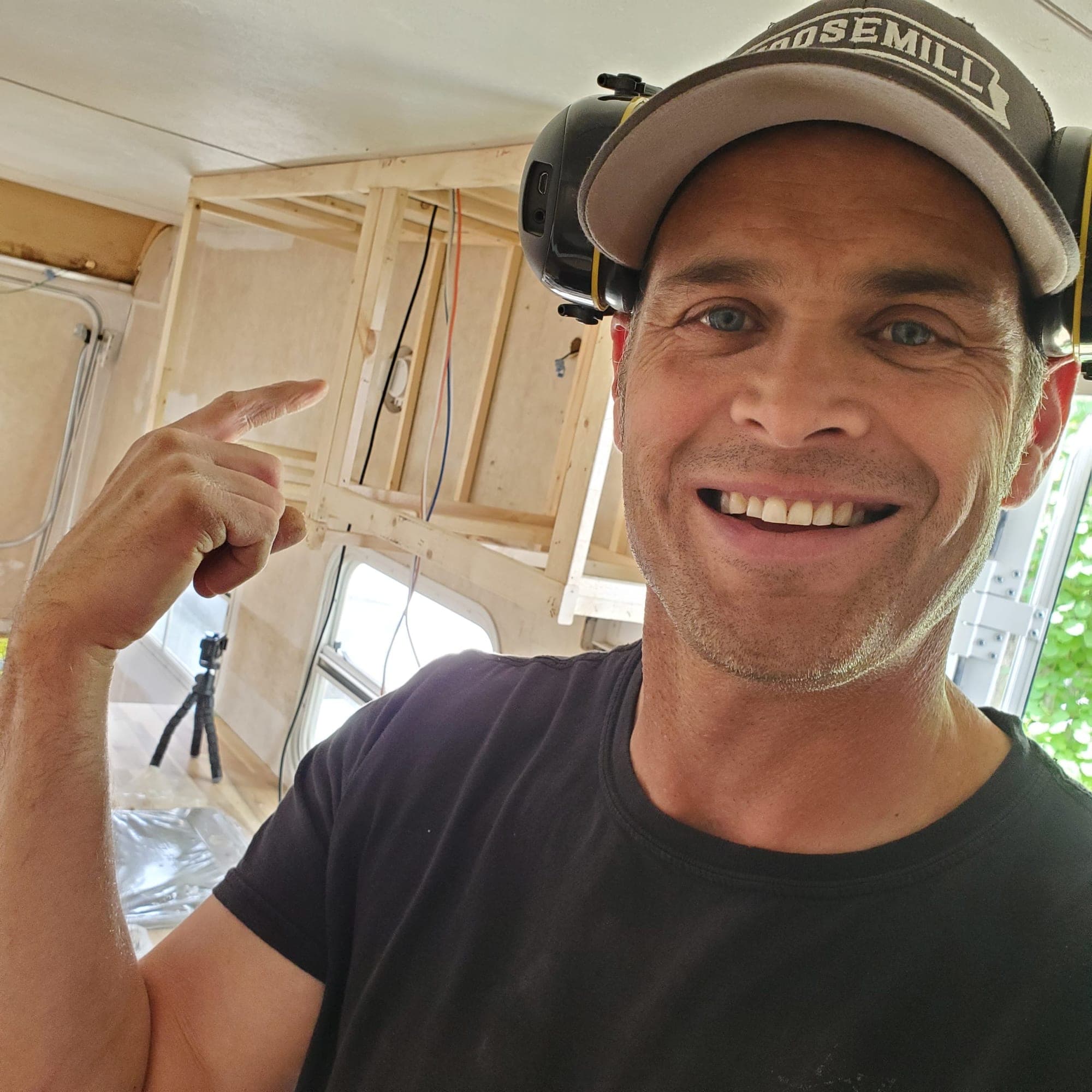 Lee smiling in the workshop, ready to film a build