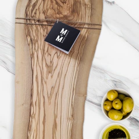 Olive wood board with the Moose Mill brand tag